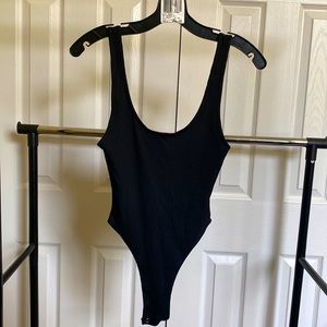 Black tank top style bodysuit from brand Because of Alice. Only worn once!